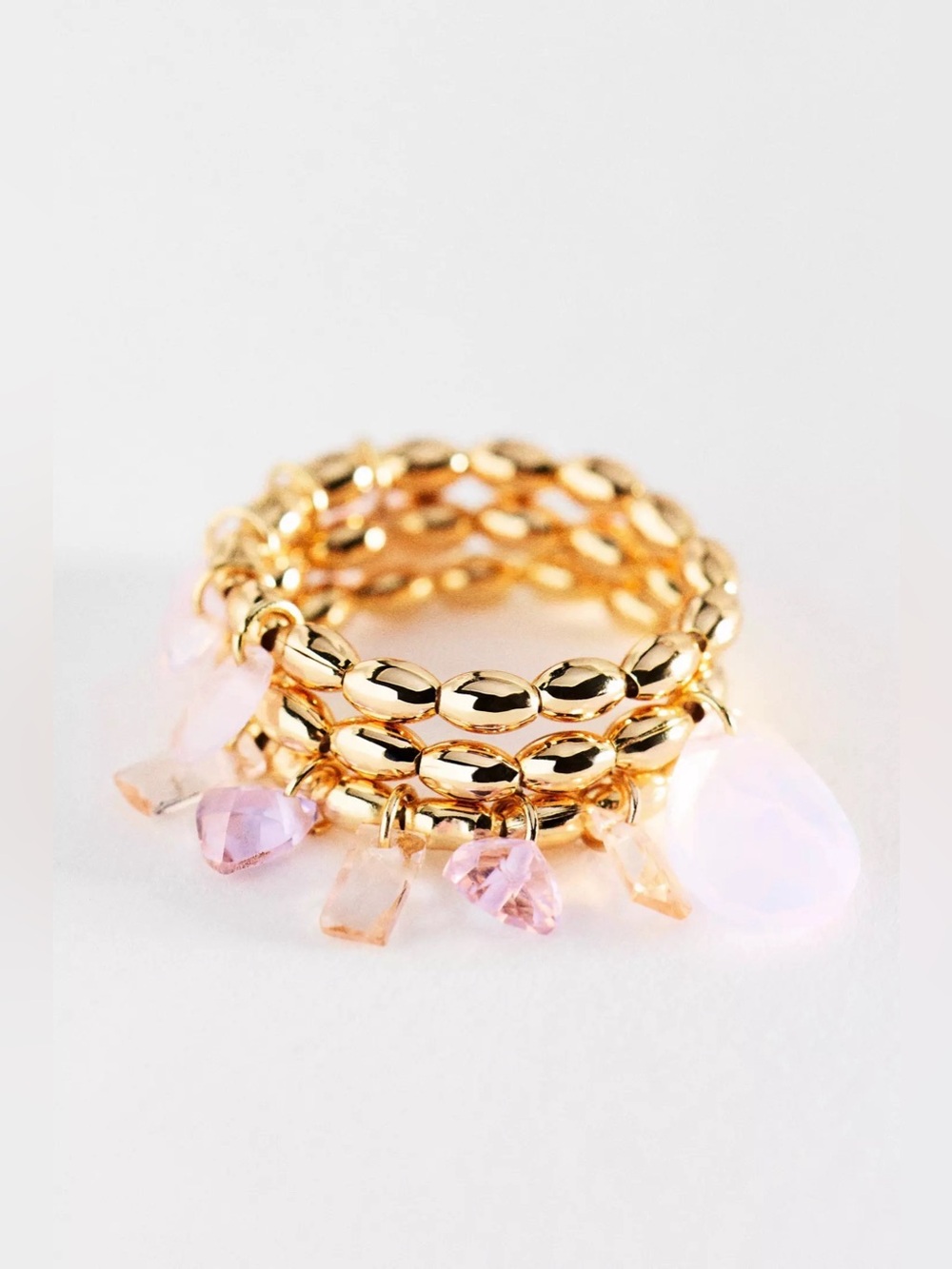 Anthropologie Gold Beaded Stackable Ring with Pink and Opalescent Charms